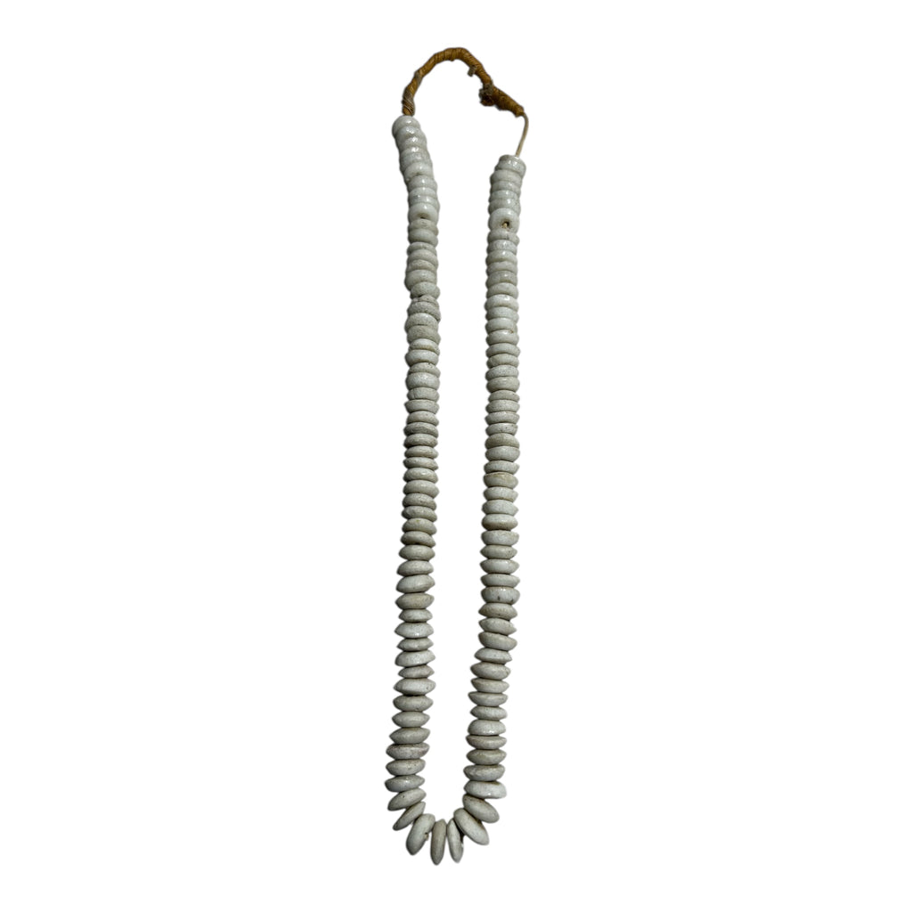 Coiled gray rope with a brown end on a white background