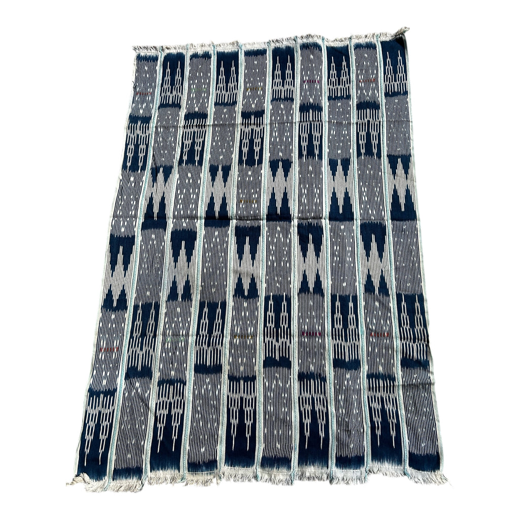Woven textile with geometric pattern on a white background