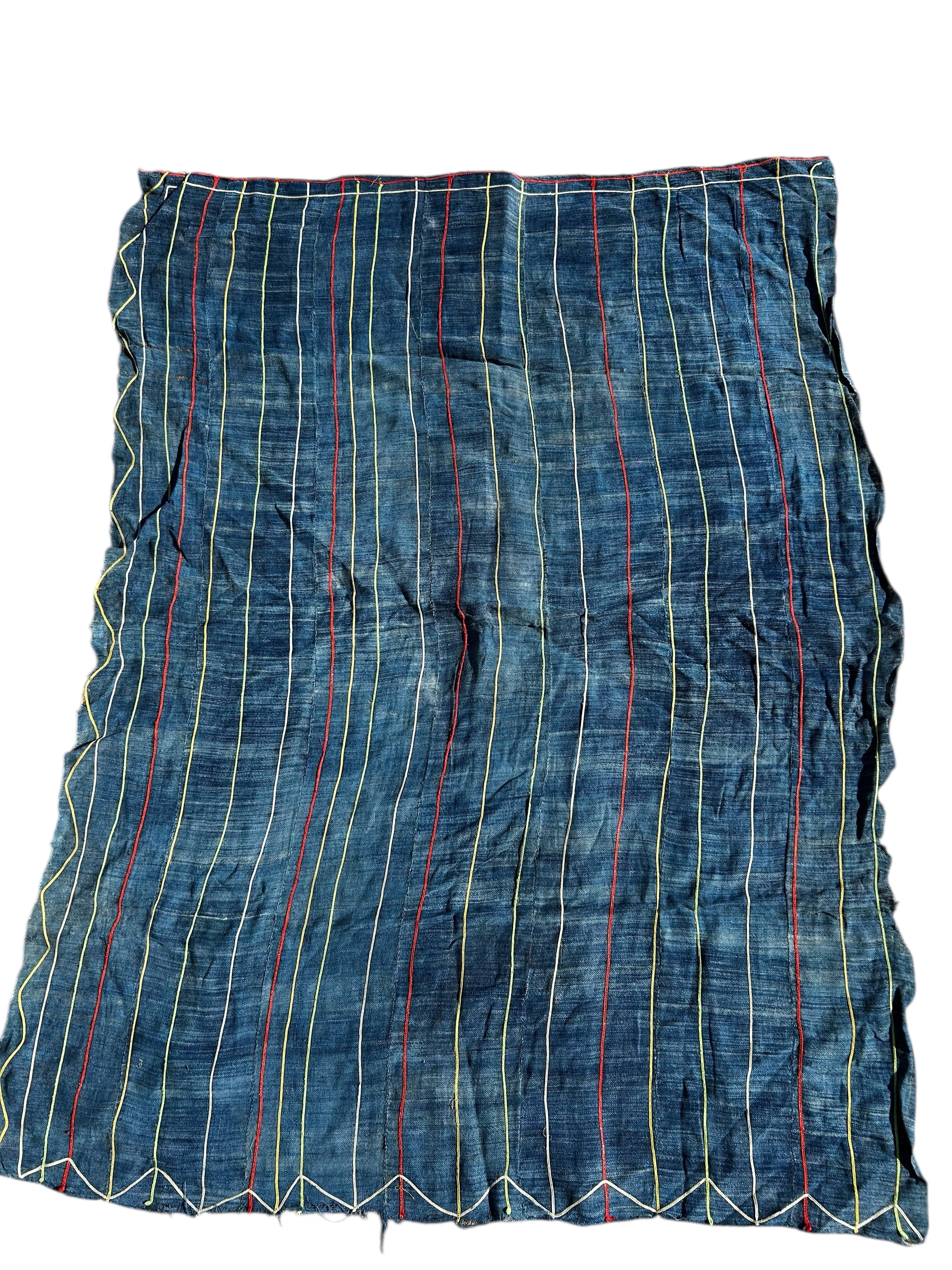 Handwoven indigo African textile with vertical stitched stripes