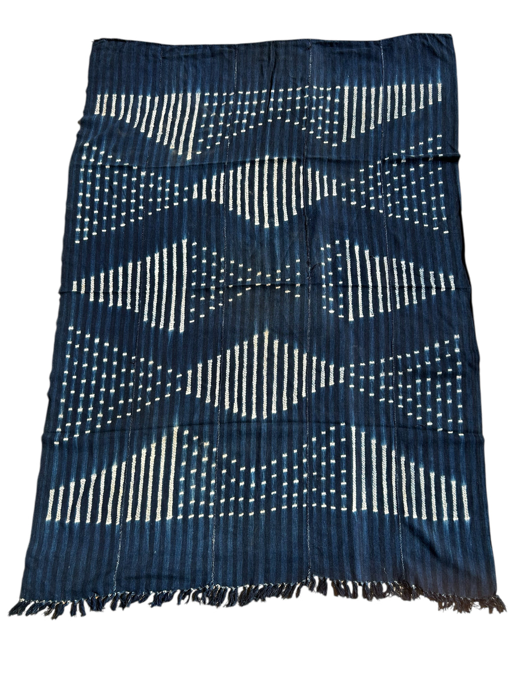 Blue and white patterned fabric with fringes on a white background