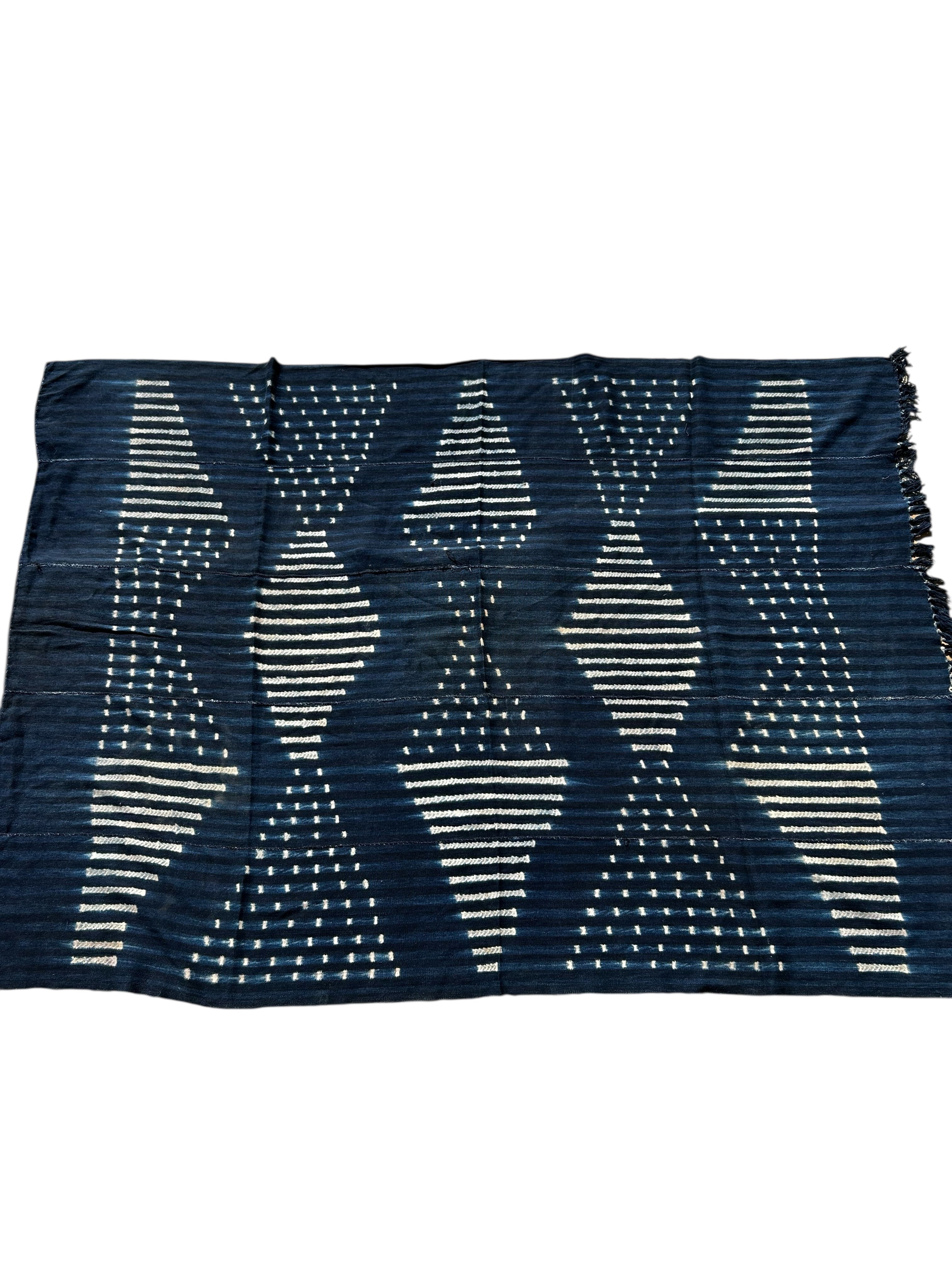 Navy blue fabric with white geometric pattern on a white background