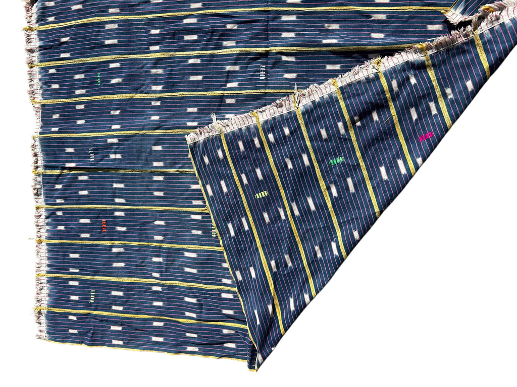 Folded fabric with a blue and white pattern on a white background